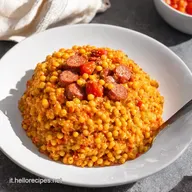 Fregula Risottata Ricetta Sarda con Salsiccia e Pomodori